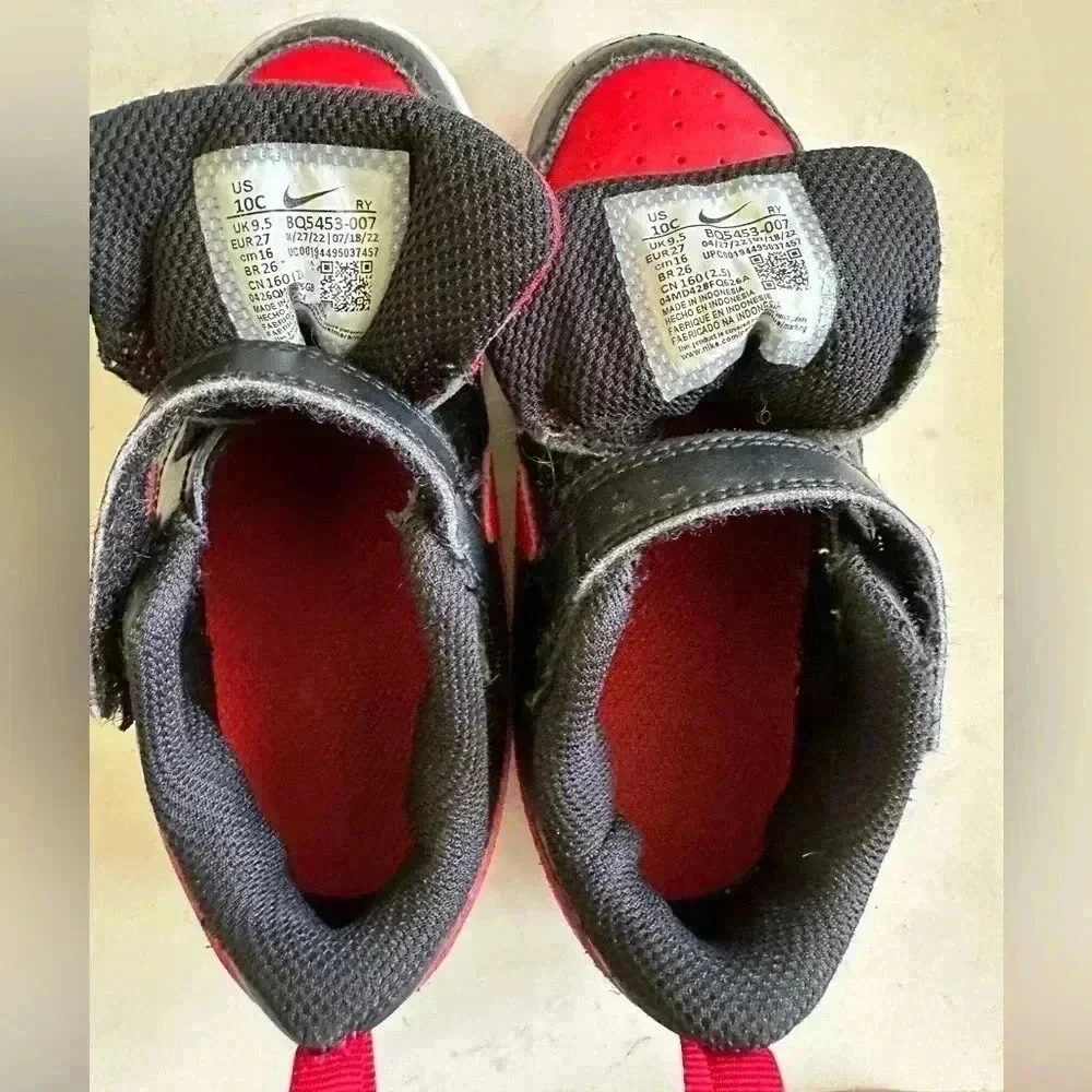 Black and red Nike Kids shoes
